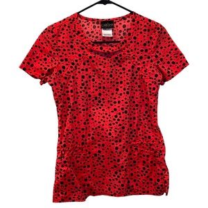 Women’s Careisma Peachy/Pink Scrub Top With Black Dot Pattern. Size X-Small.